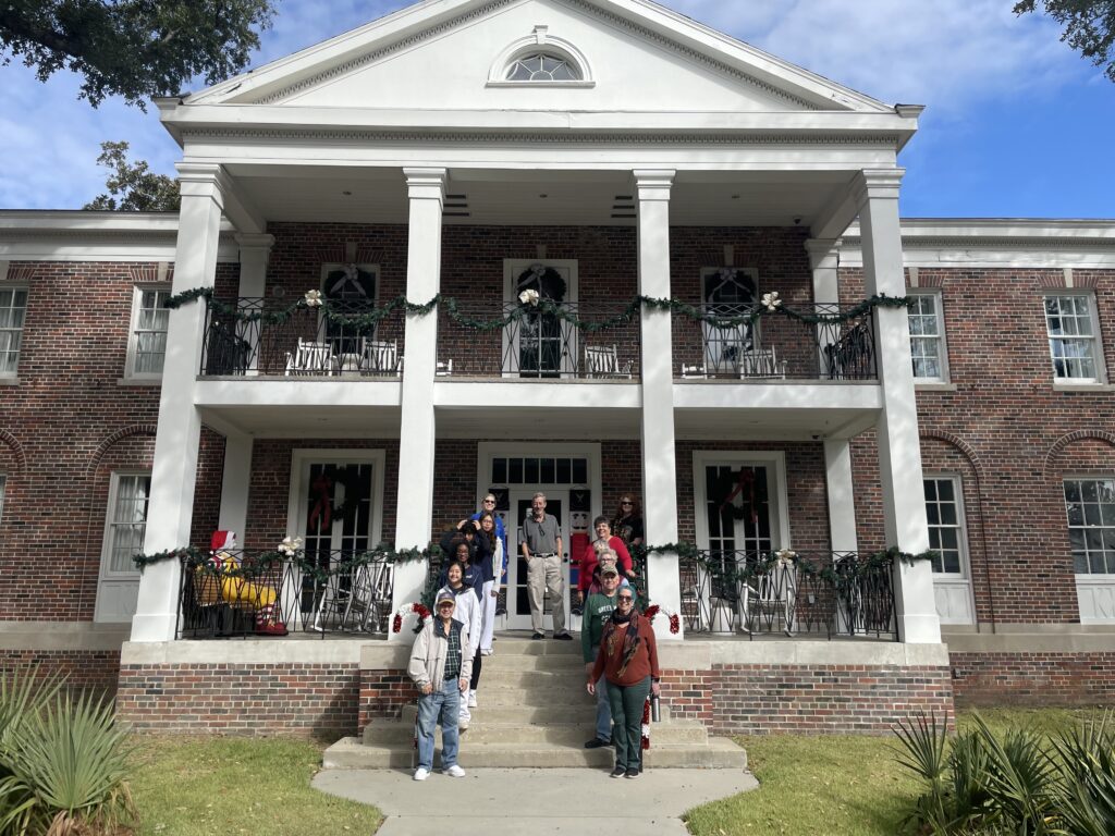 Volunteers line up one ither side of the steps in front of the Ronald McDonald House in New  Orleans, Louisiana, a non-profit that supports families while their children are in the hospital.