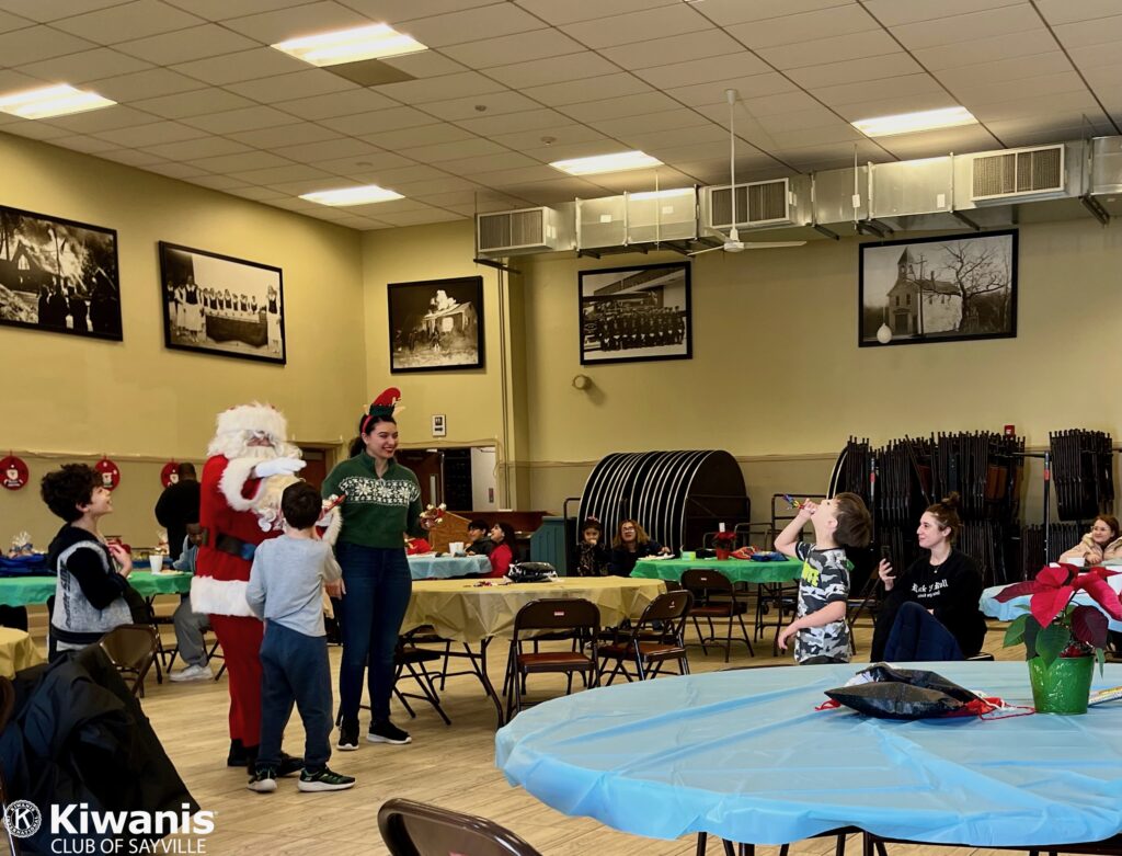 Santa and his Elf greet children and families