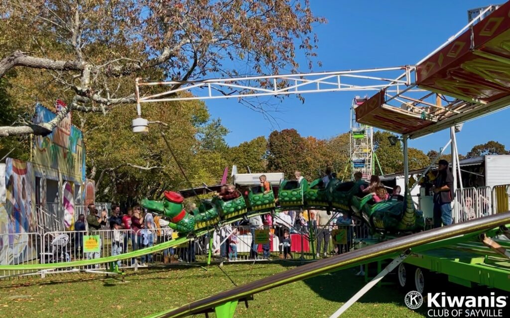 Kids Ride the roller coaster at Apple Fest on October 22, 2022