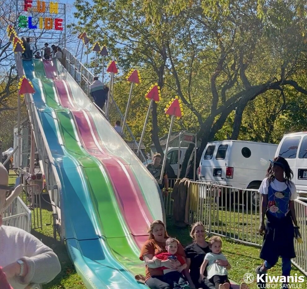 Kids ride the Fun Slide at Apple Festival 2022