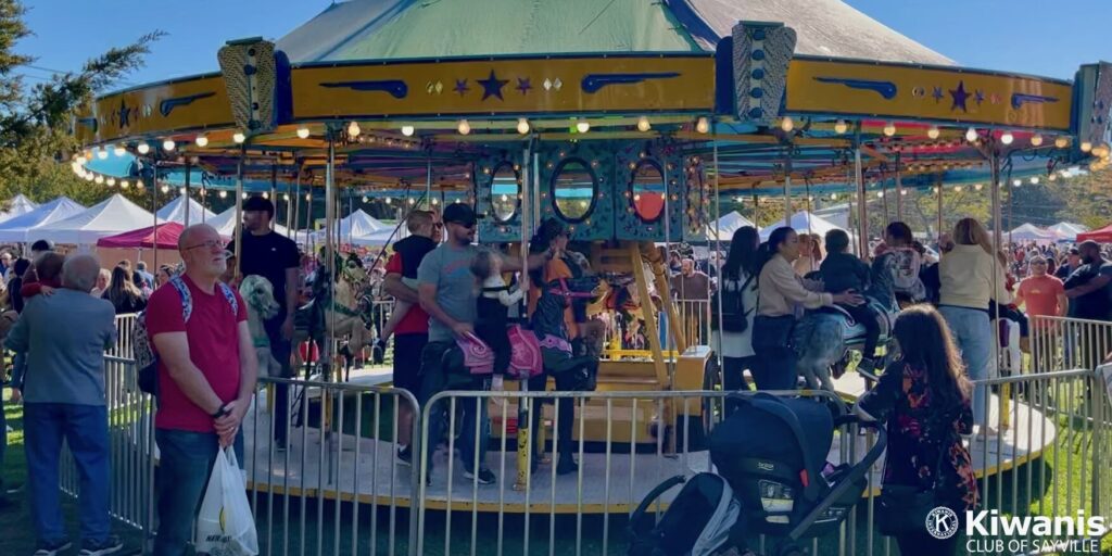 Kids ride the carousel at Apple Festival 2022