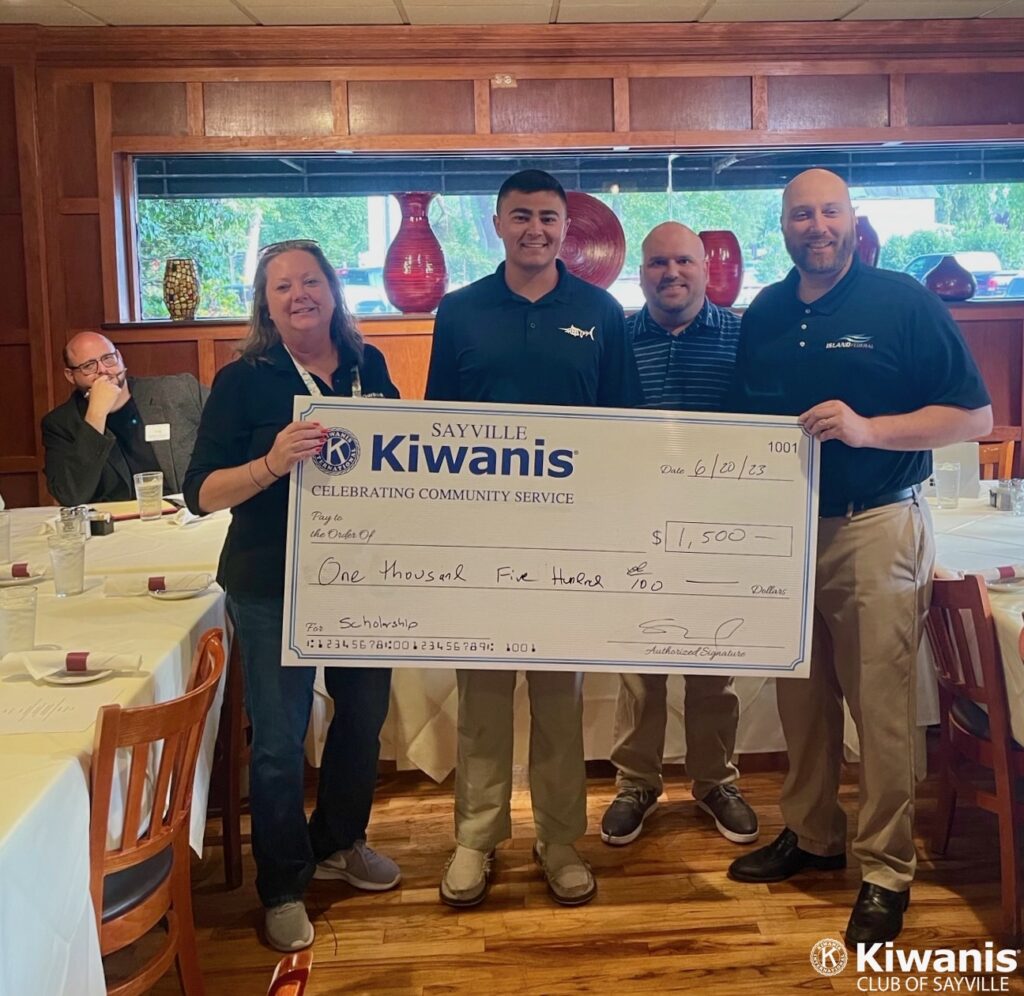 L to R: Lt. Governor Jarrod Gordon (rear), Dr. Alesia Olsen, Thomas Dutot, Treasurer Al Linsdey, President Steve Blody