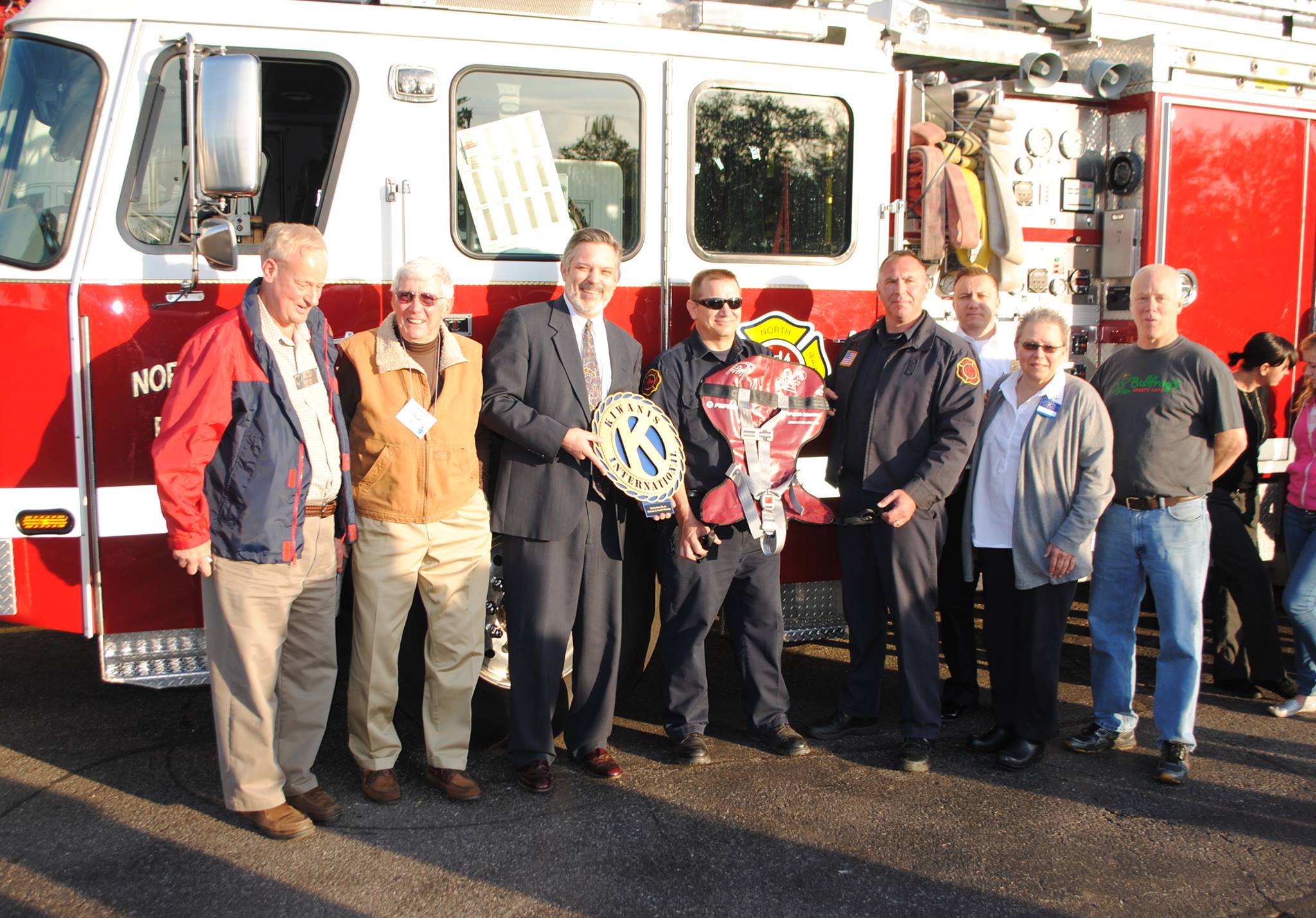 People standing in front of fire truck