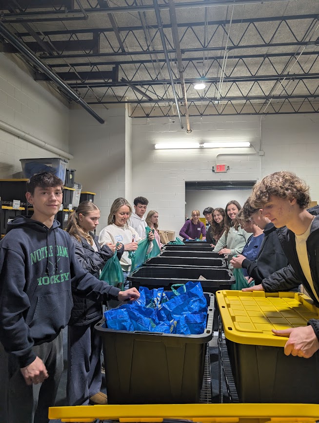 Volunteers packing food bags on Wednesday night