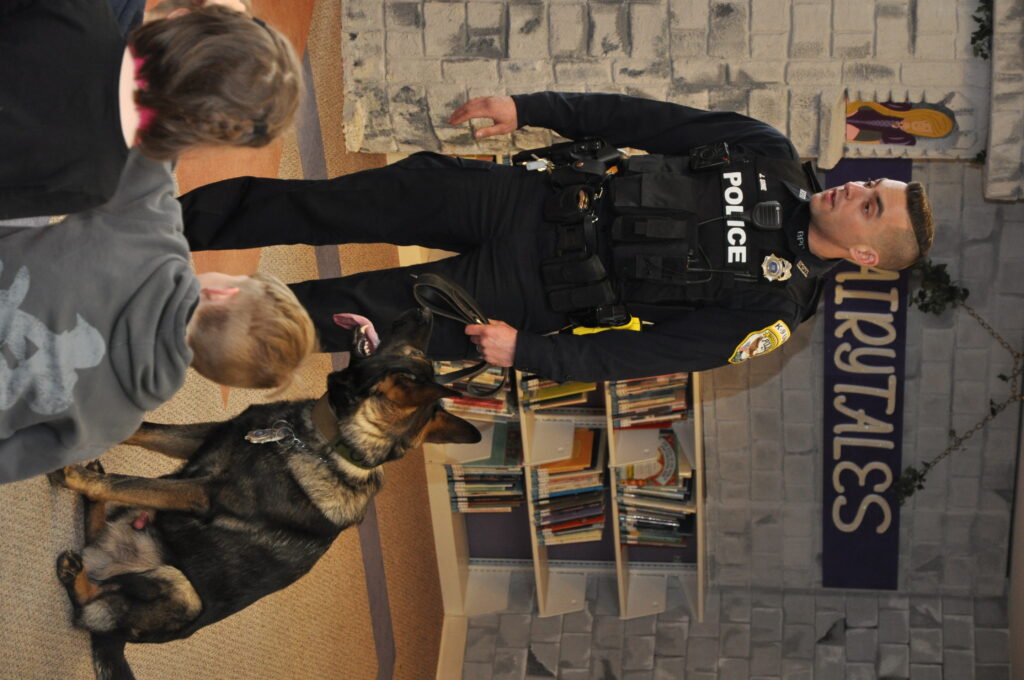 Officer Sime and Brock, the Canine Cop from Brockport Police Department at Read Around the World at the Seymour Library