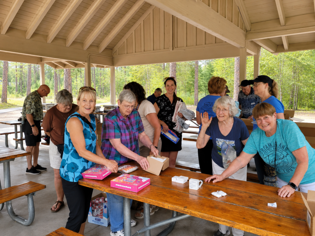 Kiwanis Club of CdA volunteers make life start kits for those in need