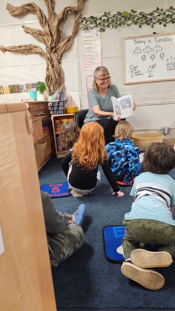 Ursula from SNR/Aktion Club reading to Head Start Children.
