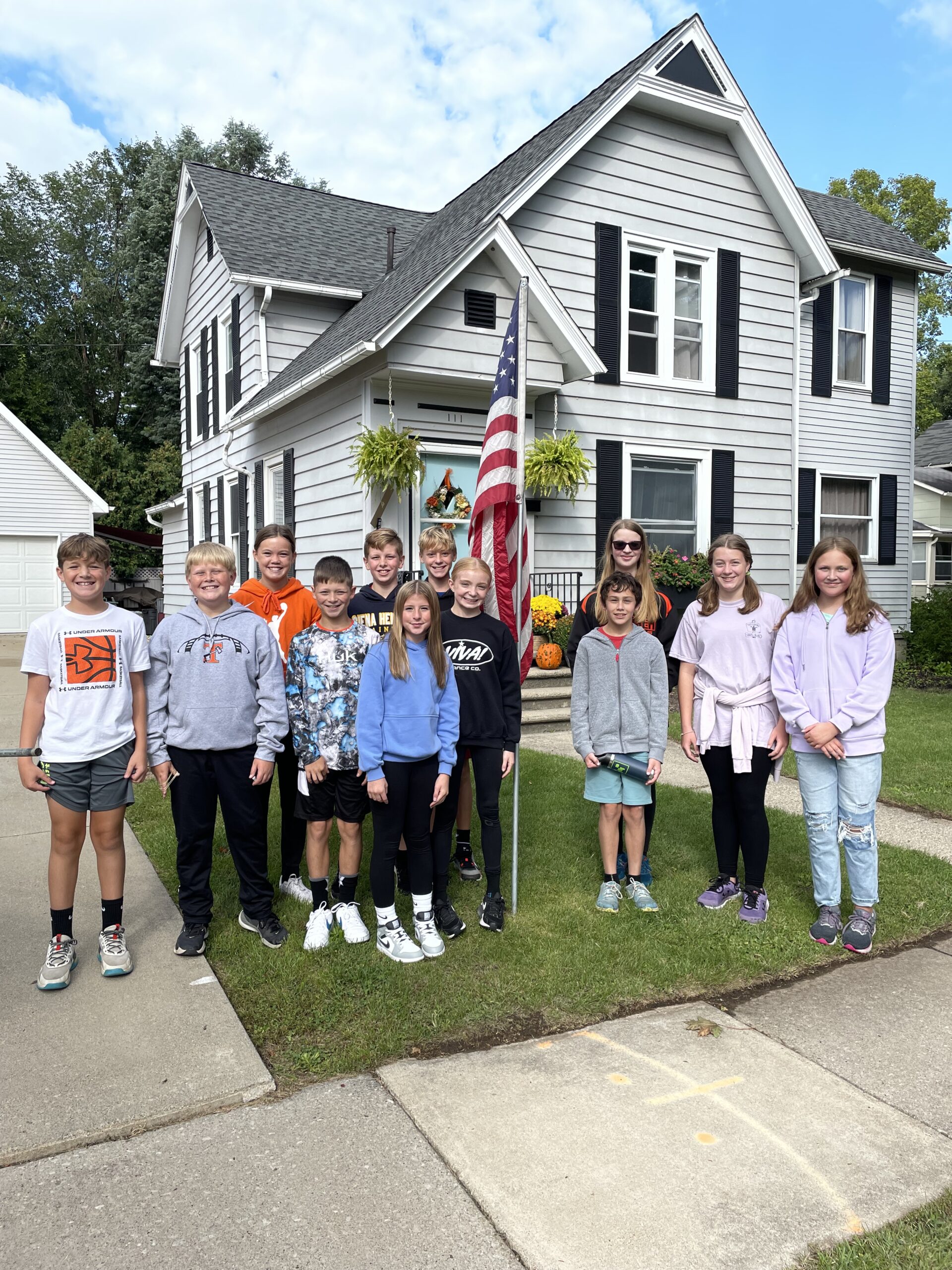 Youth assist with flag program.