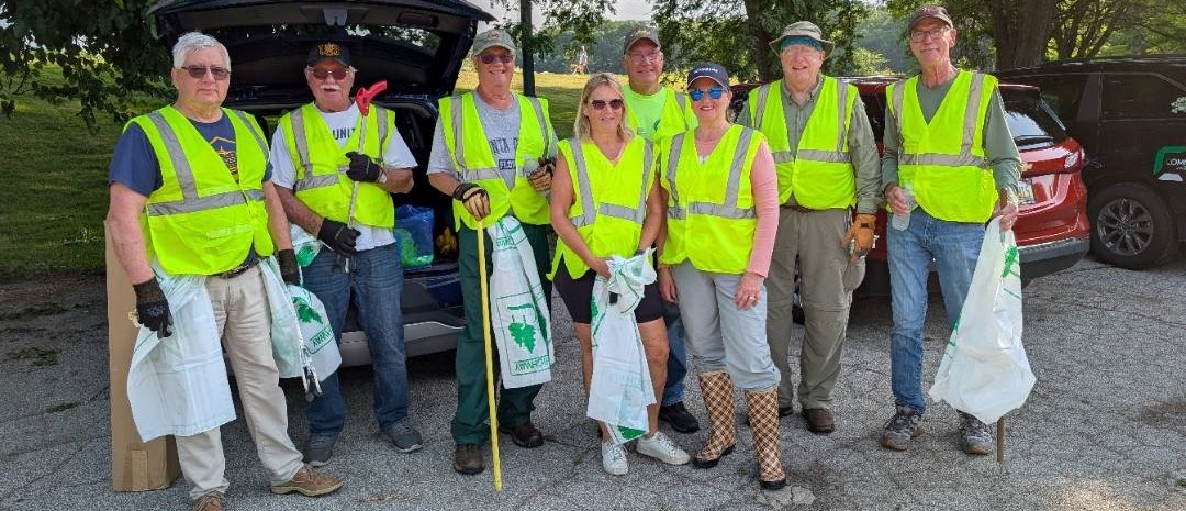 Kiwanis Volunteers wearing yellow vests for Adopt-a-Highway