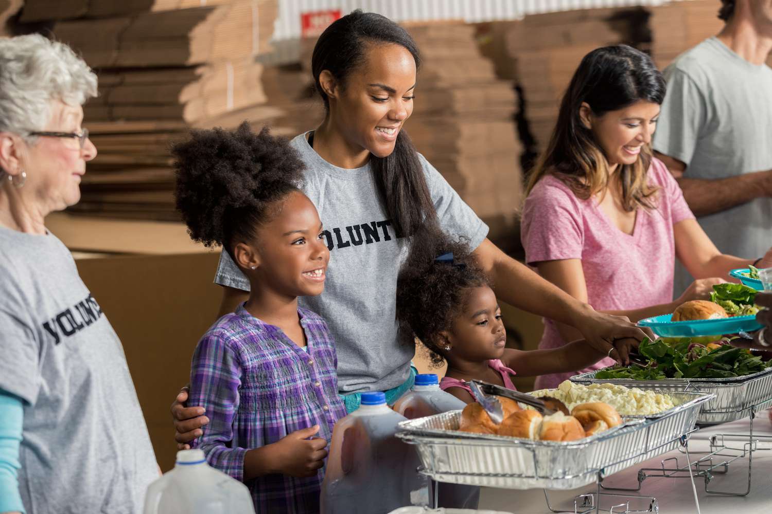 Volunteers serving food at a community event