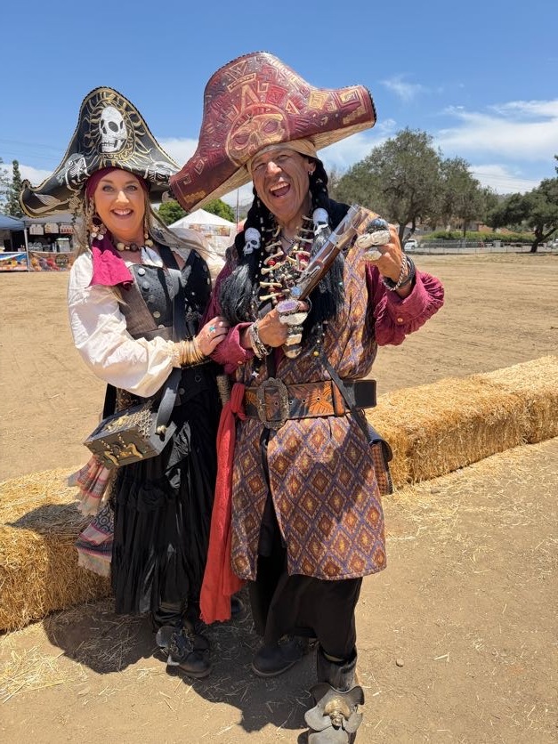 Two pirates in plumed hats