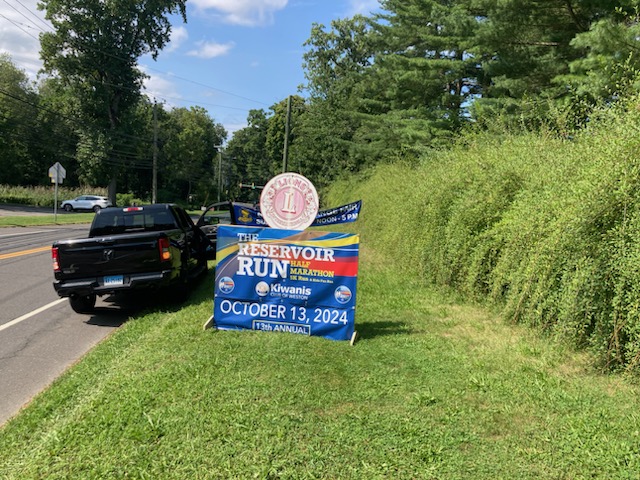 Reservoir Run sign on roadside near Weston Shopping Center