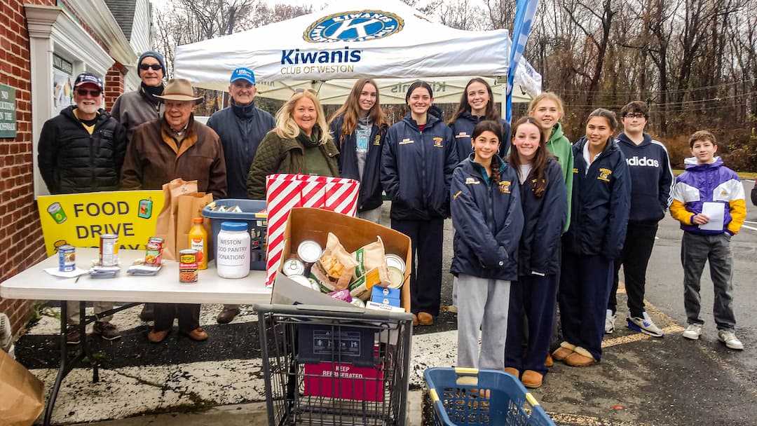 Weston Kiwanis and Weston High School Key Club members at the food drive.