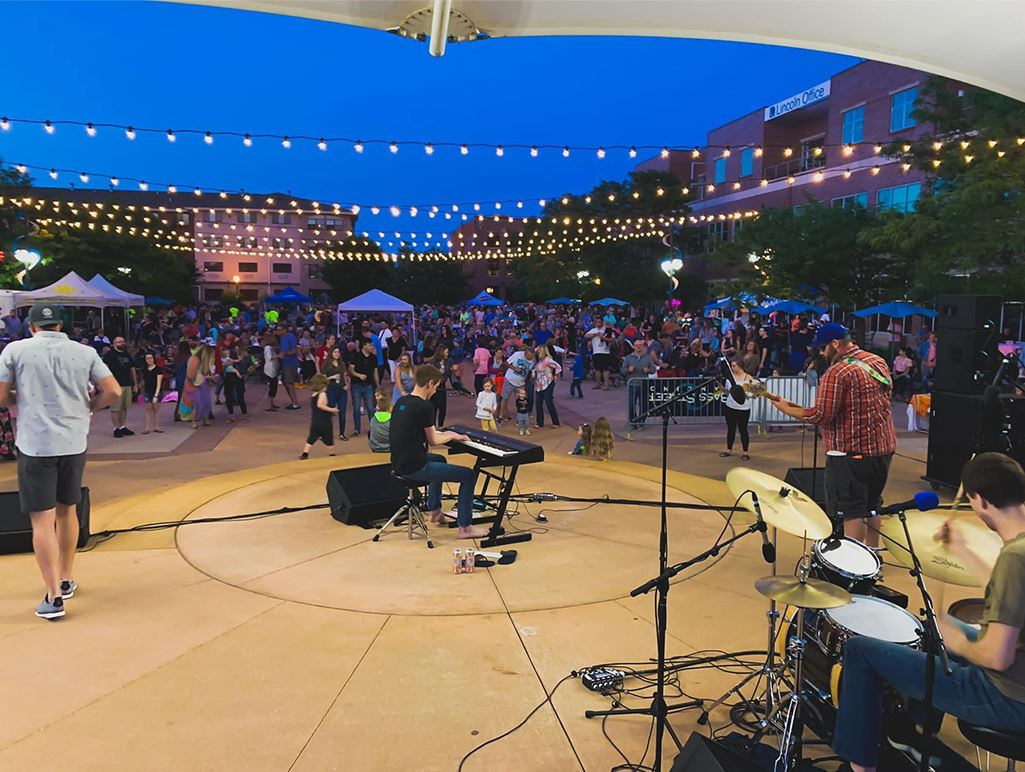 picture of a band at bass street landing performing at dusk