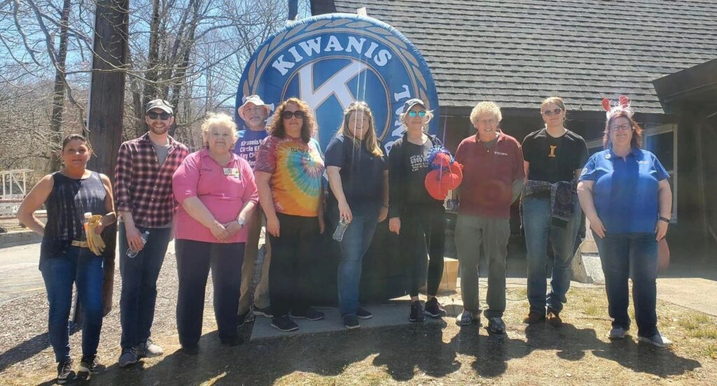 Kiwanis Club of Kent County and friends cleaning up the grounds at the Kent County YMCA.