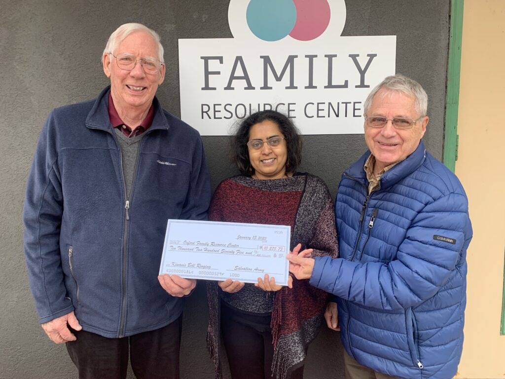 Kiwanis members present check for annual bell ringing to the Family Resource Center