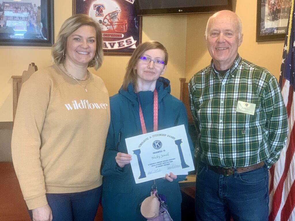 Savannah Schwegman, THS Counselor & James Michael, Kiwanis representative present Kiwanis Scholarship and Citizenship Award to Nicky Jewell.