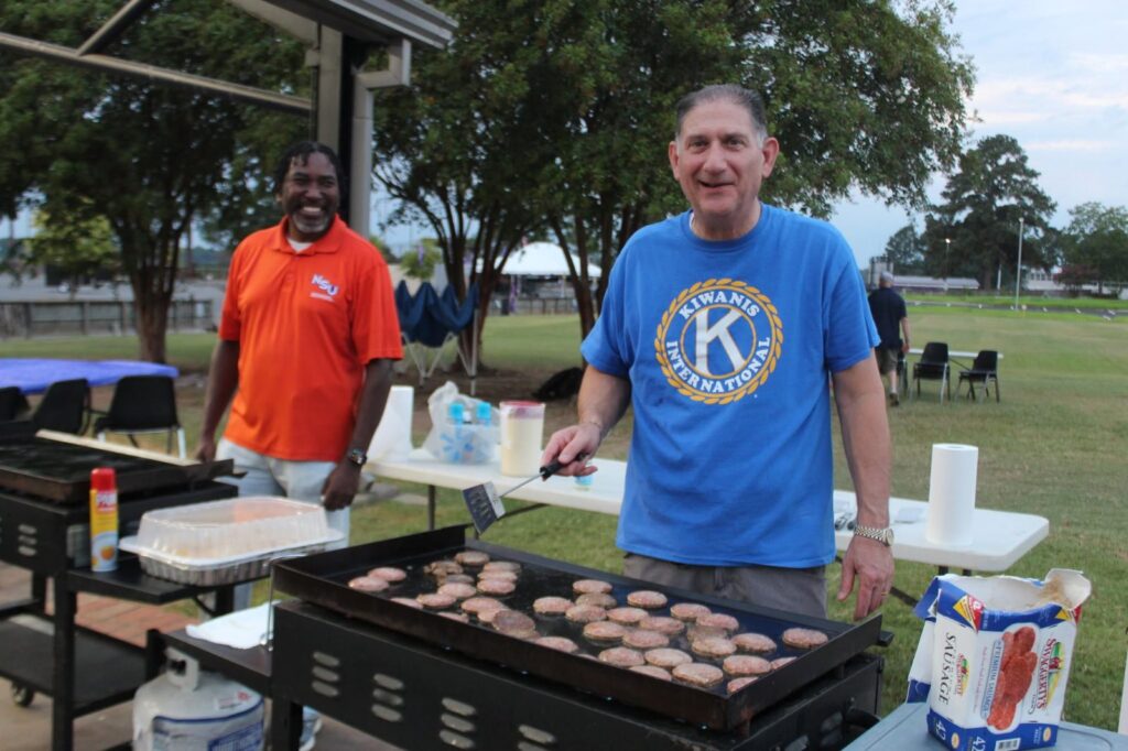 Volunteers cooking on the outdoor griddle