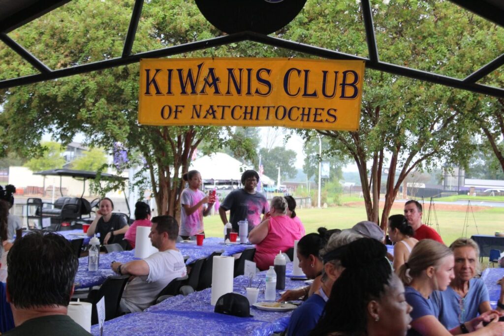 Guests gathered under the Kiwanis Club of Natchitoches sign at the Pancake Fest